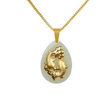 Gold pendant with a white stone on a gold chain against a white background