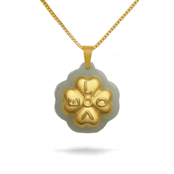 Gold necklace with a clover-shaped pendant on a white background